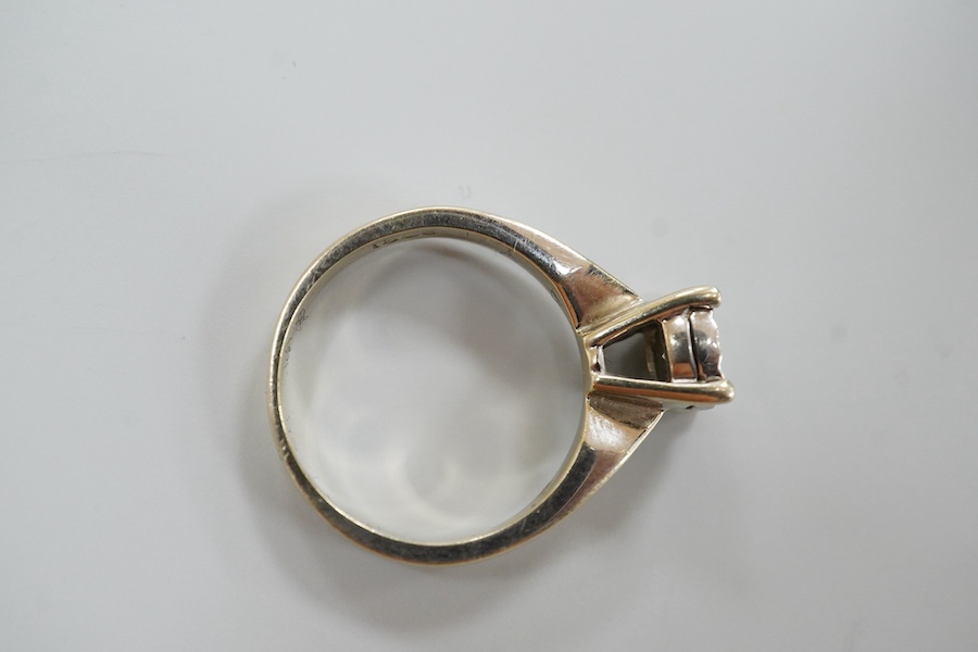 An 18ct and illusion set solitaire diamond ring, the stone weighing approximately 0.30ct, size K, gross weight 4.2 grams.